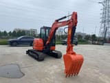 2023 Kubota U55-4 mini excavator, rear three-quarter view