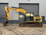 2011 Caterpillar 319DL crawler excavator, side view