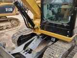 2020 Caterpillar 305E mini excavator, front-side view of cab and blade