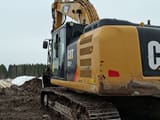2017 Caterpillar 323F crawler excavator, rear three-quarter view