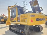 2024 Komatsu PC210 crawler excavator, rear three-quarter view