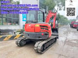 2023 Kubota KX057-4 mini excavator, rear three-quarter view