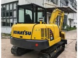 2024 Komatsu PC56 mini excavator, rear three-quarter view