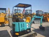 2023 Komatsu PC18 mini excavator, rear three-quarter view