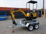 JPC HT-12 mini excavator on a trailer, side view