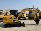 2023 Caterpillar 305.5E mini excavator, side profile view