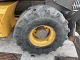 2007 Volvo EW140B wheel excavator tire and wheel detail