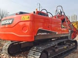 2023 Doosan DX225LC-9C excavator, rear three-quarter view