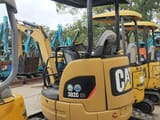 2023 Caterpillar 302C CR mini excavator, rear three-quarter view