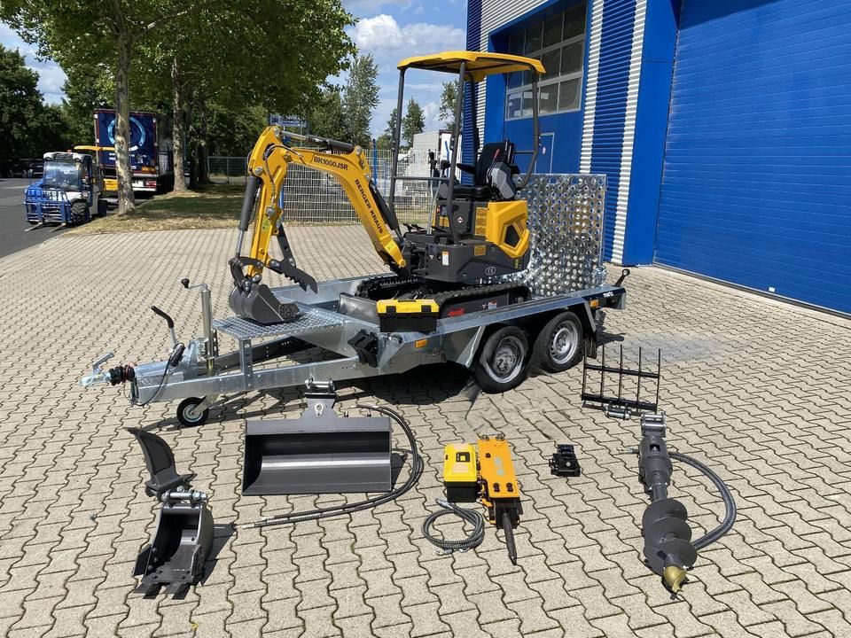 Berger Kraus BK1000JSR mini excavator on trailer with attachments