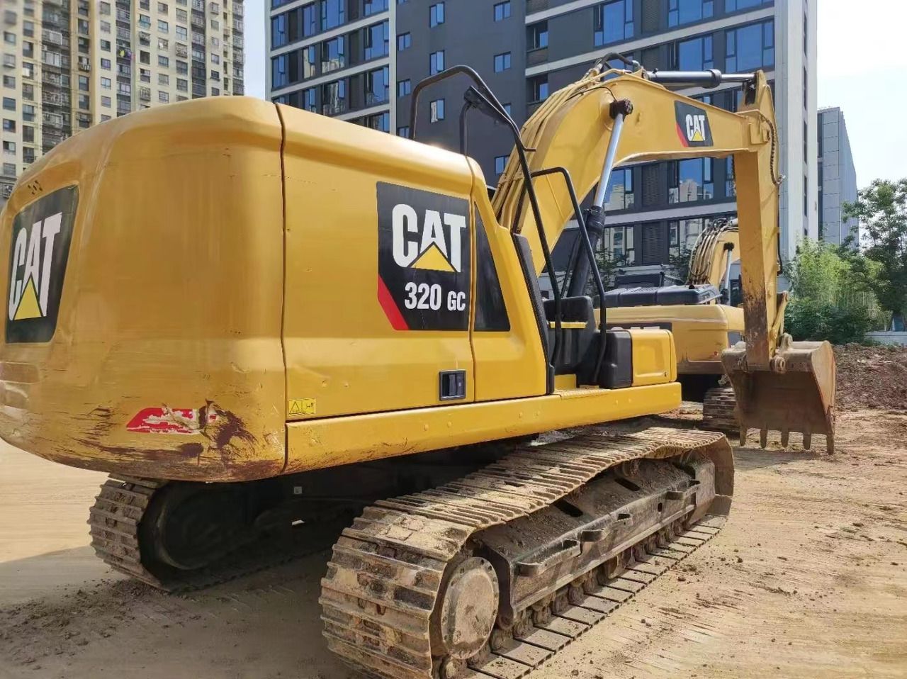 2023 Caterpillar 320GC crawler excavator, rear three-quarter view 2023 Caterpillar 320GC crawler excavator, rear three-quarter view