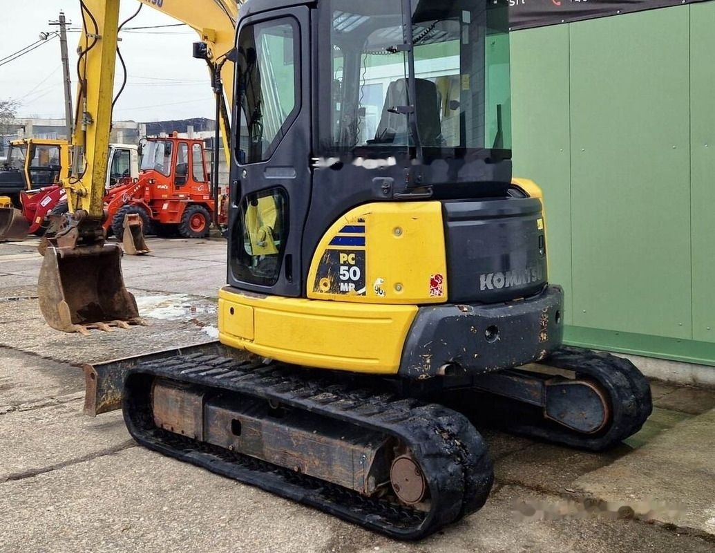 2016 Komatsu PC50MR-2 mini excavator, rear three-quarter view 2016 Komatsu PC50MR-2 mini excavator, rear three-quarter view