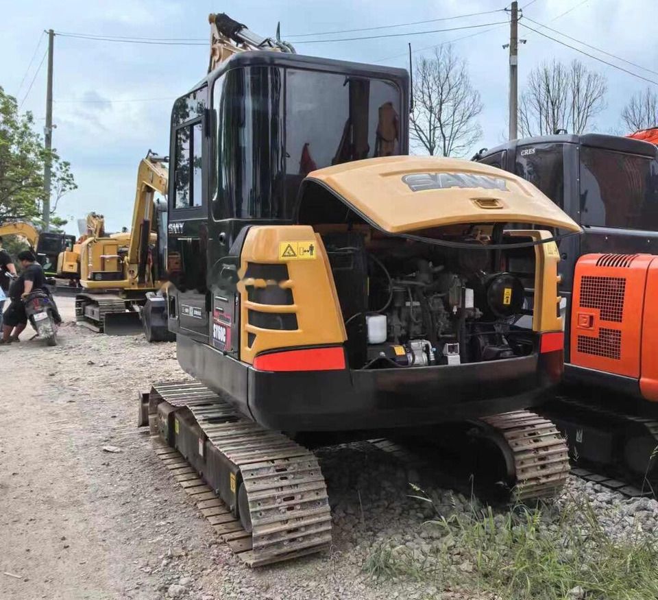 Sany SY60C mini excavator, rear three-quarter view with engine cover open Sany SY60C mini excavator, rear three-quarter view with engine cover open