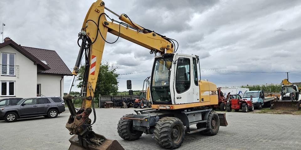 2010 Liebherr A314 wheel excavator, side profile view