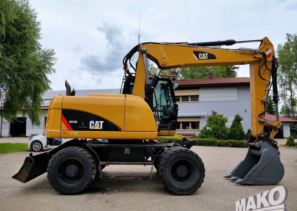 2012 CAT M313D wheel excavator side view