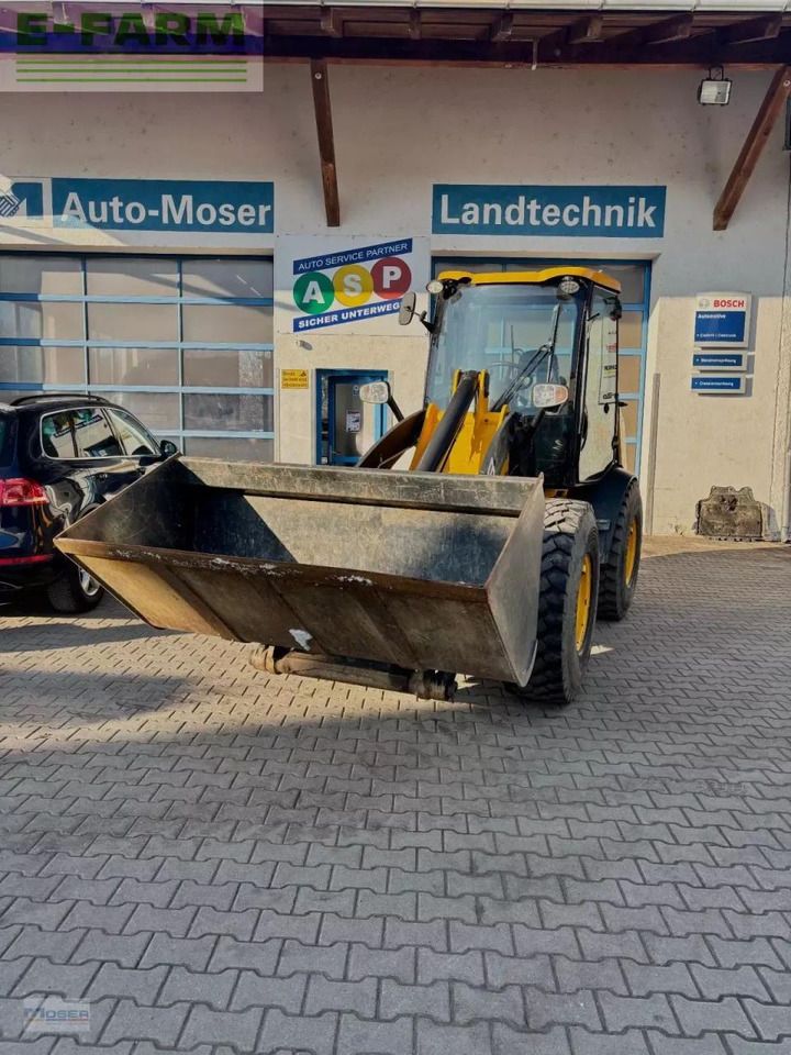 2011 JCB 409 wheel loader, front three-quarter view