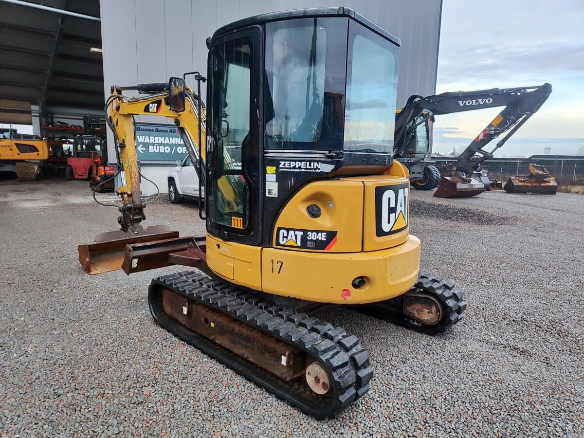 2012 Caterpillar 304E CR mini excavator, rear three-quarter view