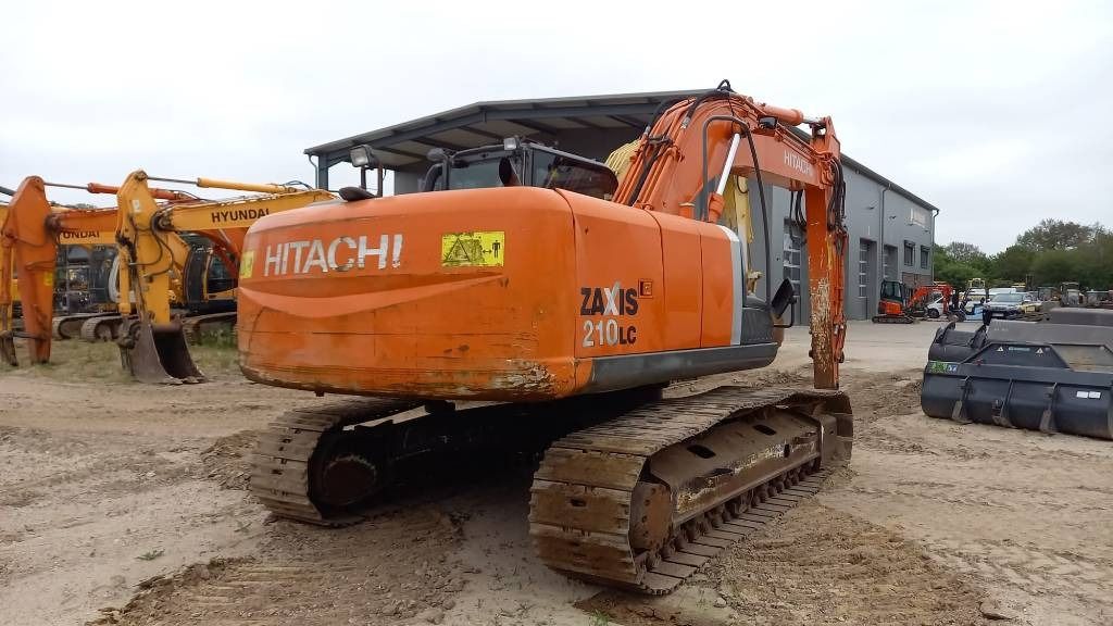 2012 Hitachi Zaxis 210LC crawler excavator, rear three-quarter view 2012 Hitachi Zaxis 210LC crawler excavator, rear three-quarter view
