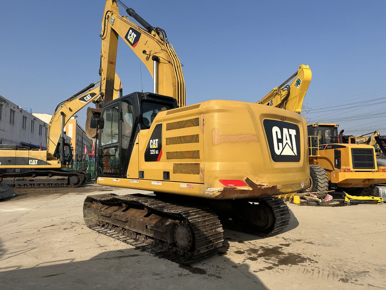 Caterpillar 320GC crawler excavator, rear three-quarter view