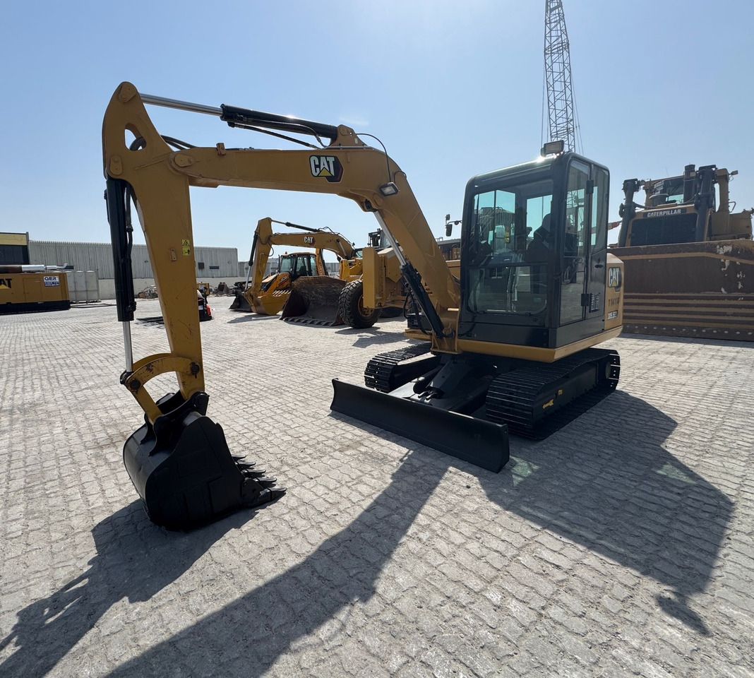 2023 Caterpillar 305.5E2 mini excavator, front three-quarter view 2023 Caterpillar 305.5E2 mini excavator, front three-quarter view