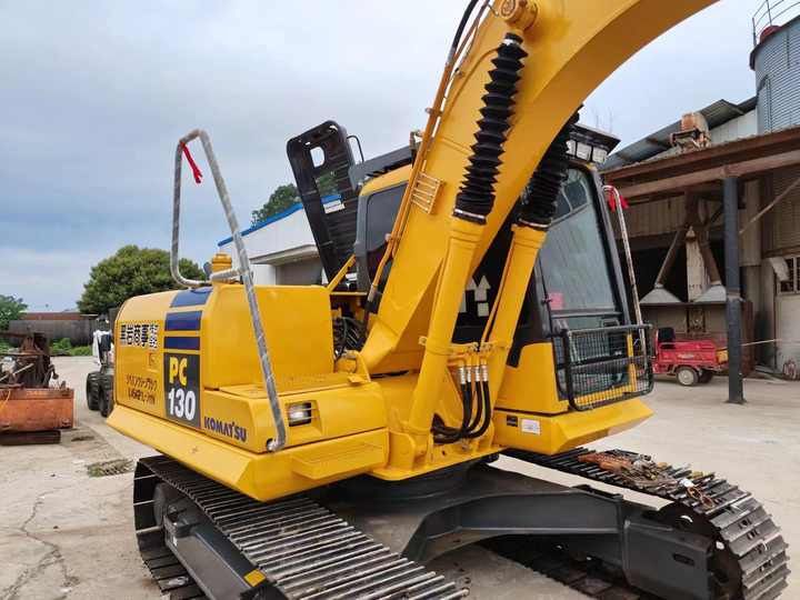 2019 Komatsu PC130 crawler excavator, rear three-quarter view 2019 Komatsu PC130 crawler excavator, rear three-quarter view