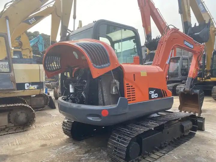 2019 Doosan DX60 crawler excavator rear view with engine cover open 2019 Doosan DX60 crawler excavator rear view with engine cover open