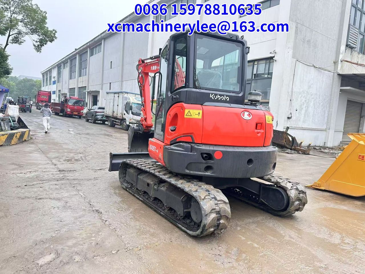 2023 Kubota KX057-4 mini excavator, rear three-quarter view