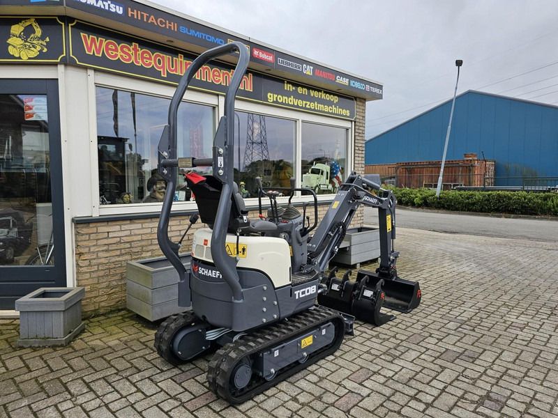 2023 Schaeff TC08 mini excavator, rear three-quarter view