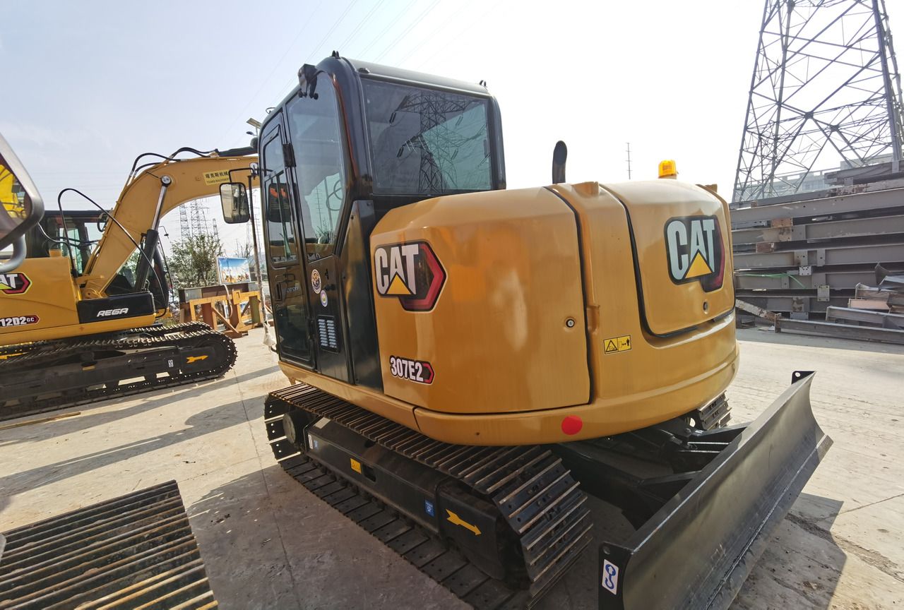 2024 Caterpillar 307E2 mini excavator, rear three-quarter view 2024 Caterpillar 307E2 mini excavator, rear three-quarter view