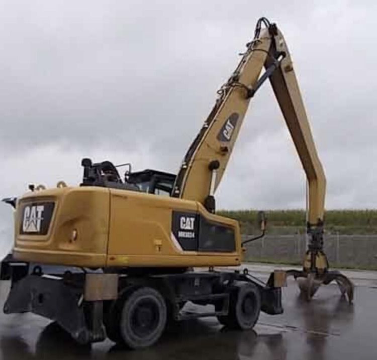 2015 Caterpillar MH3024 material handler, rear three-quarter view