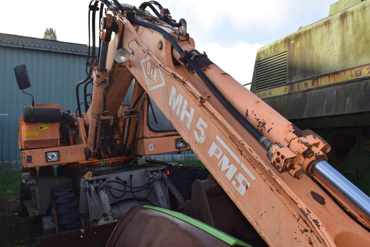 1990 O&K MH 5 wheel excavator, side view of boom and cab 1990 O&K MH 5 wheel excavator, side view of boom and cab