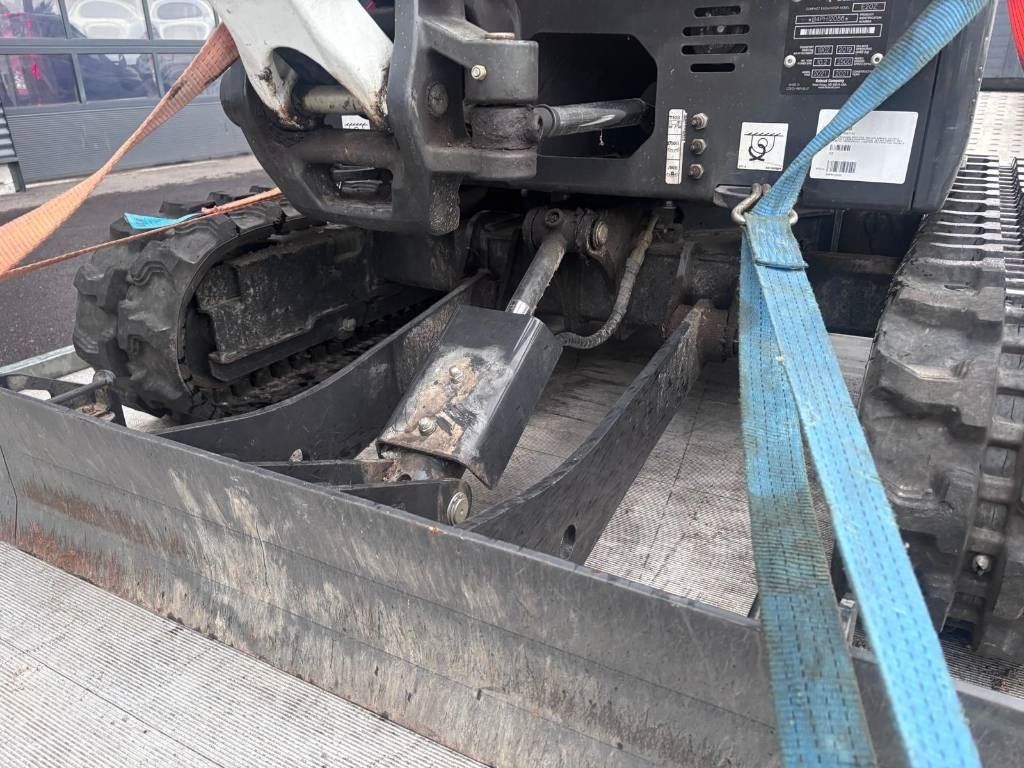 2021 Bobcat E20Z mini excavator front blade and undercarriage view 2021 Bobcat E20Z mini excavator front blade and undercarriage view