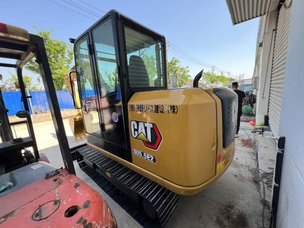 2024 Caterpillar 305.5E2 mini excavator, rear three-quarter view 2024 Caterpillar 305.5E2 mini excavator, rear three-quarter view