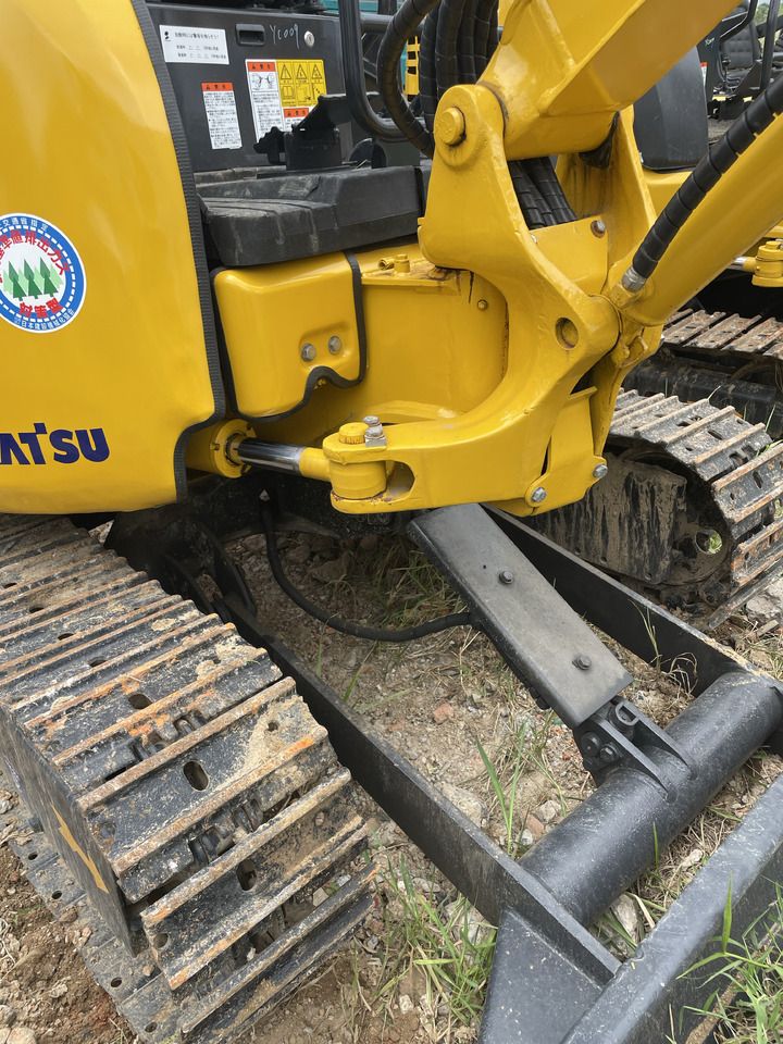 2022 Komatsu PC20MR-3 mini excavator side view of boom base and tracks 2022 Komatsu PC20MR-3 mini excavator side view of boom base and tracks