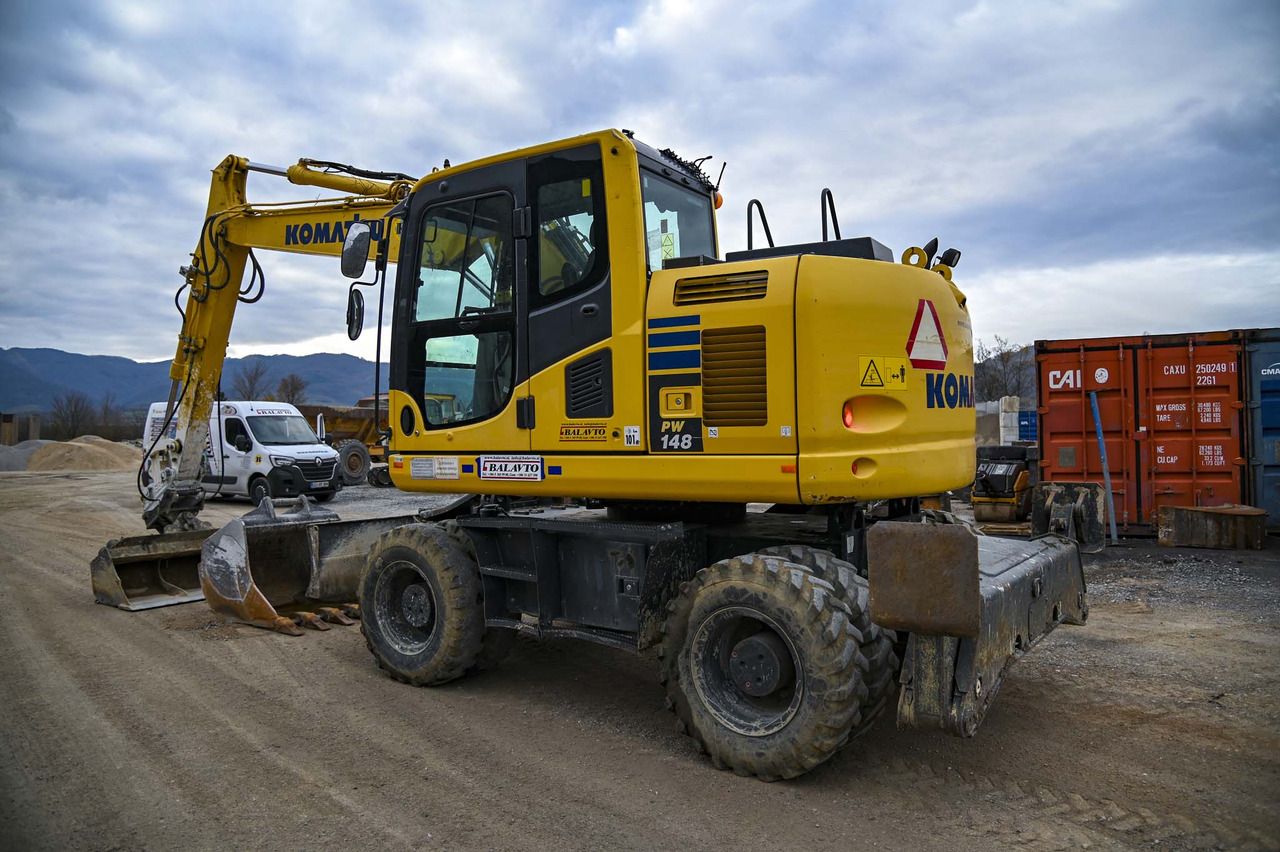 2018 Komatsu PW148-10 wheel excavator, rear three-quarter view 2018 Komatsu PW148-10 wheel excavator, rear three-quarter view