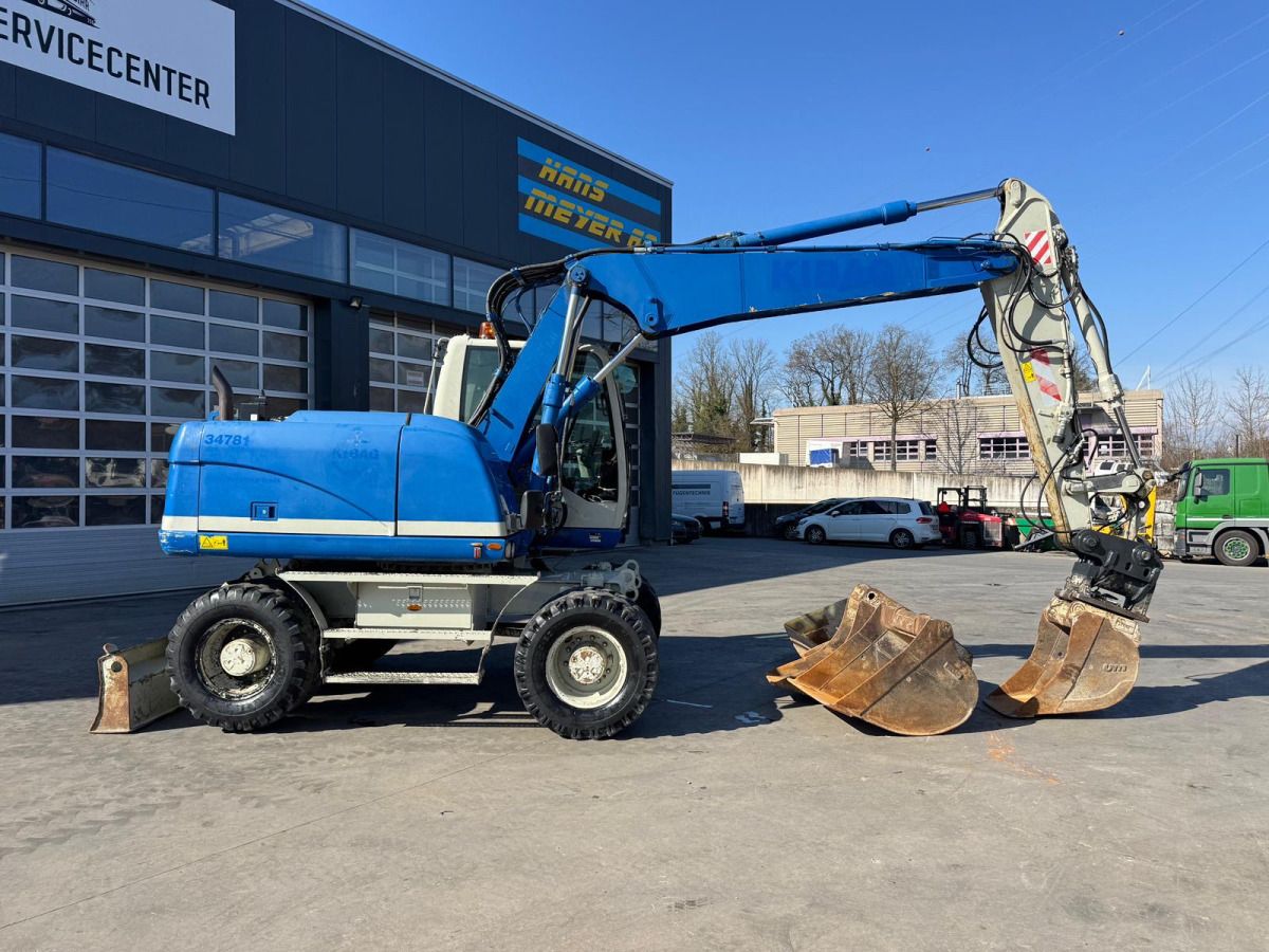 2015 Caterpillar M313D wheel excavator, side view 2015 Caterpillar M313D wheel excavator, side view