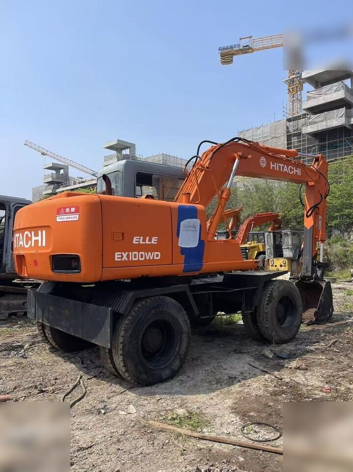 1993 Hitachi EX100WD wheel excavator, rear three-quarter view 1993 Hitachi EX100WD wheel excavator, rear three-quarter view