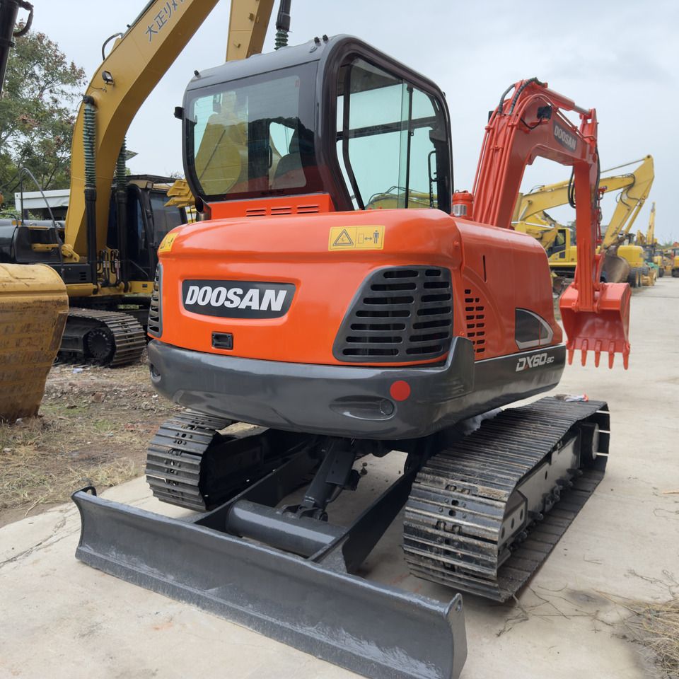 Doosan DX60-9C Mini Excavator, rear three-quarter view Doosan DX60-9C Mini Excavator, rear three-quarter view