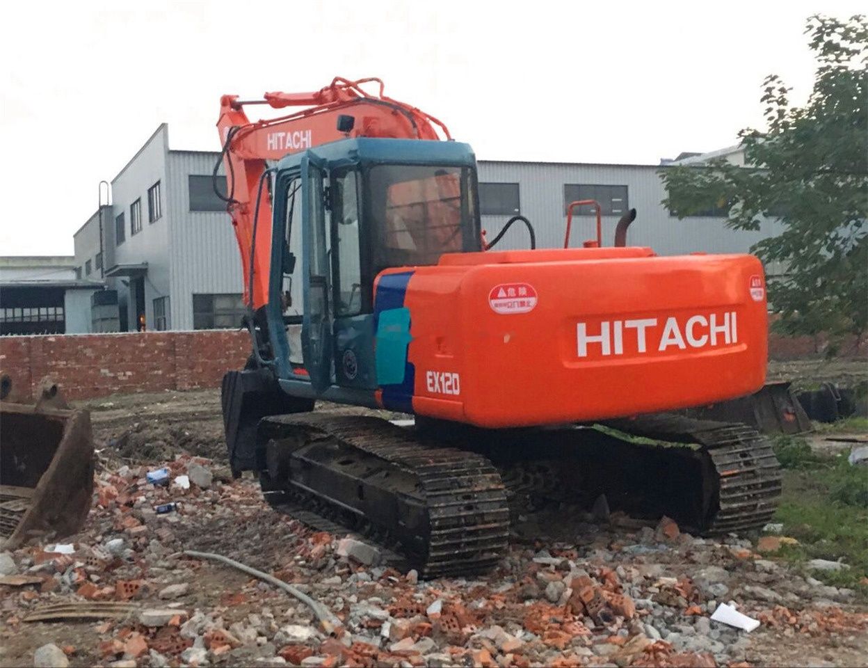 2018 Hitachi EX120-3 crawler excavator, rear three-quarter view 2018 Hitachi EX120-3 crawler excavator, rear three-quarter view