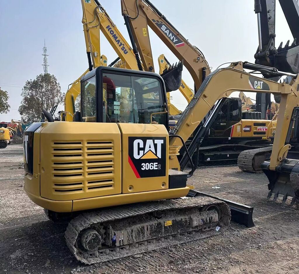 Caterpillar 306E2 mini excavator, rear three-quarter view Caterpillar 306E2 mini excavator, rear three-quarter view