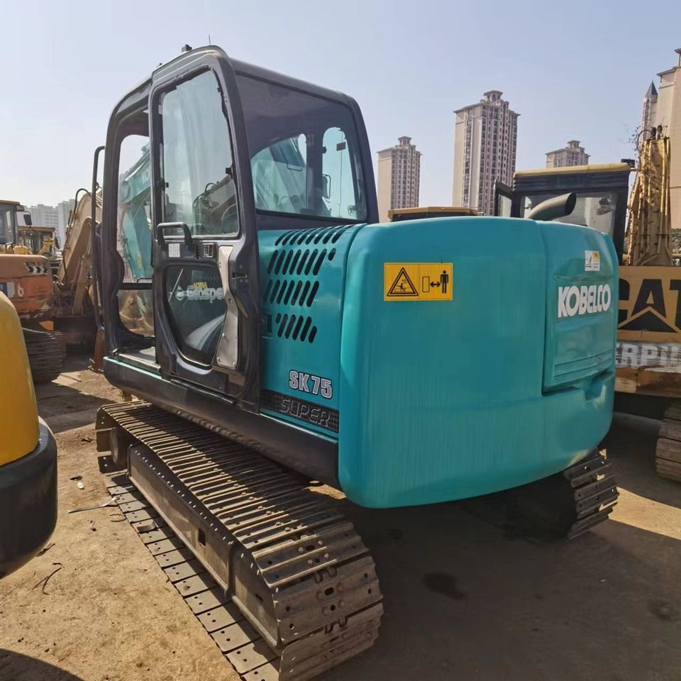Kobelco SK75 Super mini excavator, rear three-quarter view