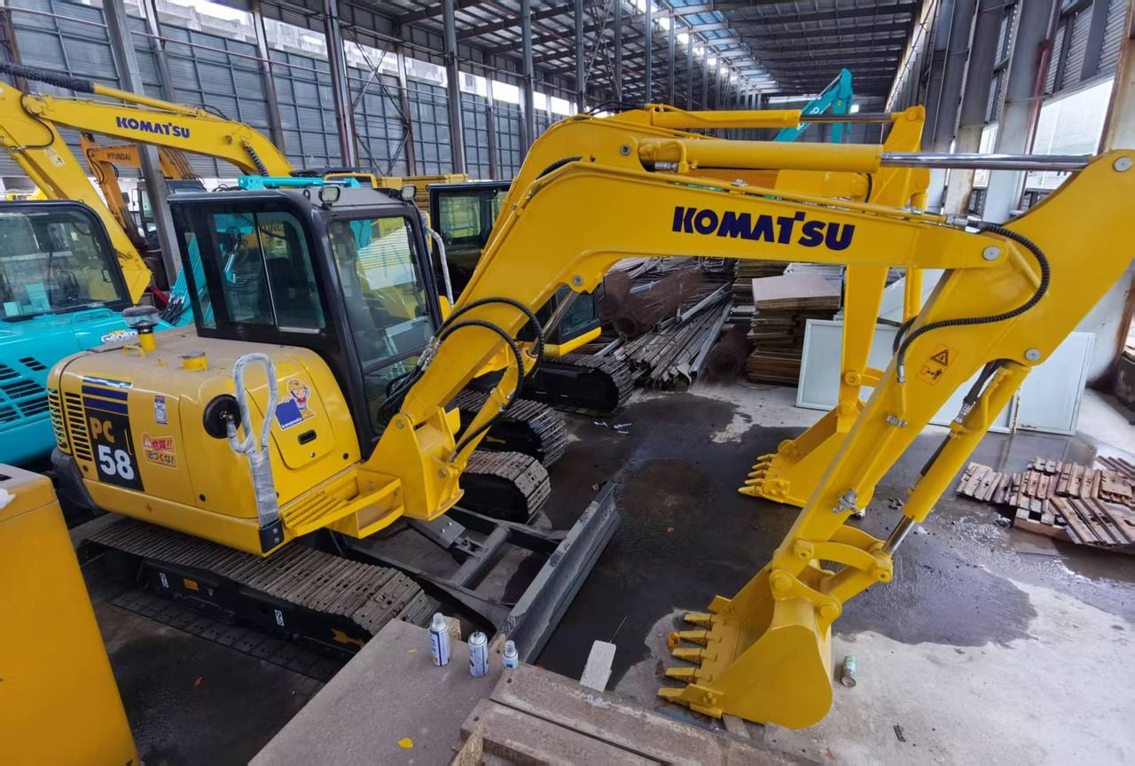 2015 Komatsu PC58 mini excavator, high-angle side view 2015 Komatsu PC58 mini excavator, high-angle side view