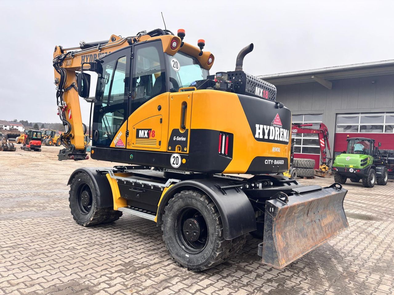 2023 Hydrema MX18G wheel excavator, rear three-quarter view 2023 Hydrema MX18G wheel excavator, rear three-quarter view