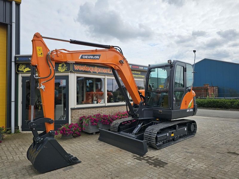 2024 Develon DX60E-10N mini excavator, side view