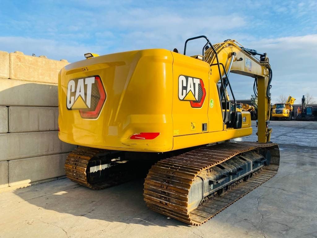2021 Caterpillar 323 crawler excavator rear three-quarter view 2021 Caterpillar 323 crawler excavator rear three-quarter view