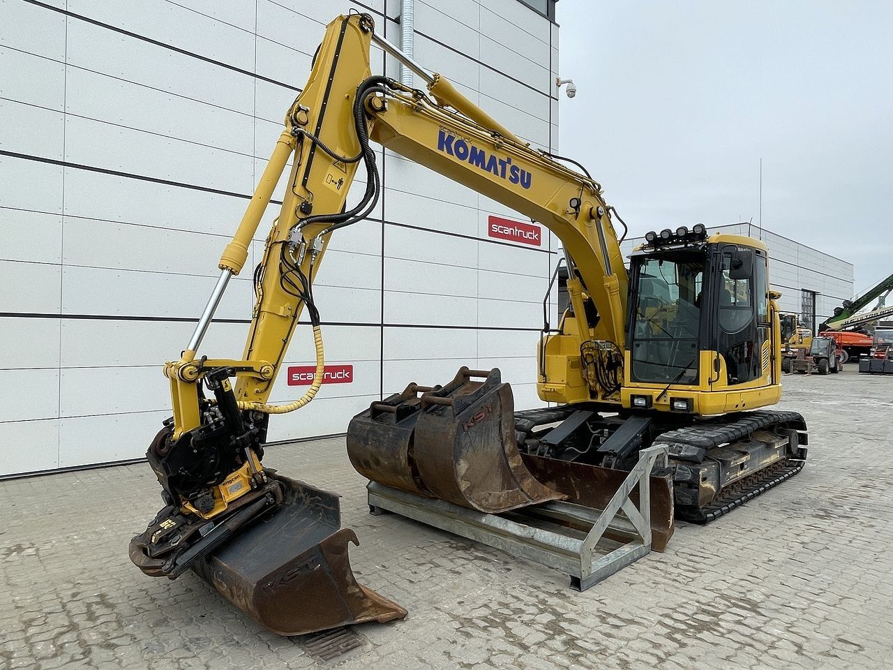 2022 Komatsu PC138US-11 crawler excavator, front three-quarter view