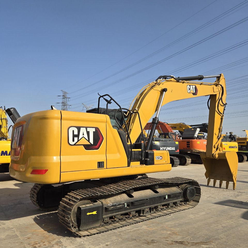 2023 Caterpillar 323GC crawler excavator, rear three-quarter view