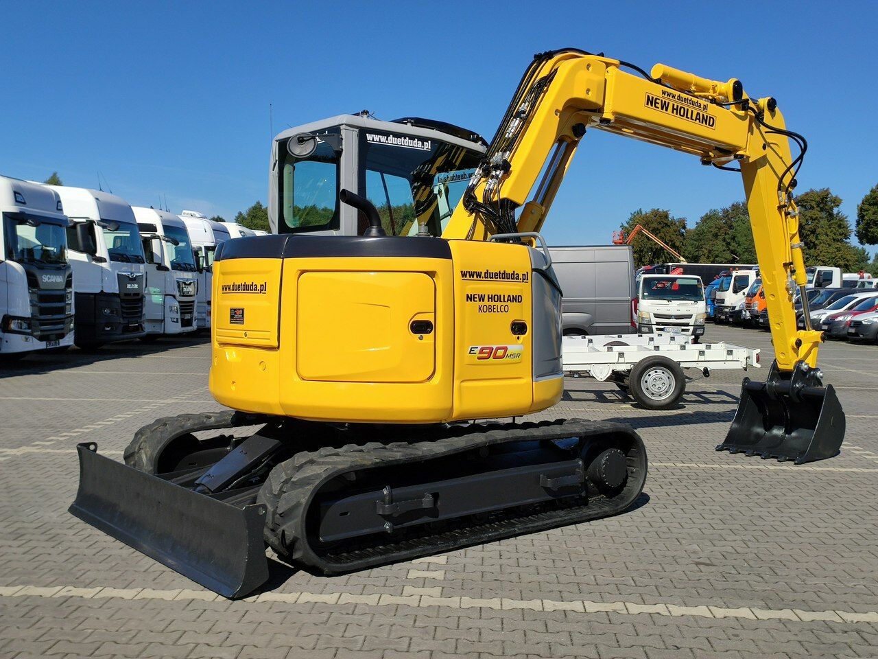 2012 New Holland E90MSR mini excavator, rear three-quarter view 2012 New Holland E90MSR mini excavator, rear three-quarter view
