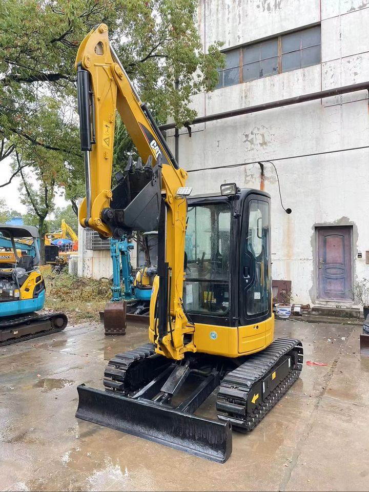 2023 Caterpillar 303.5 C CR mini excavator, front three-quarter view