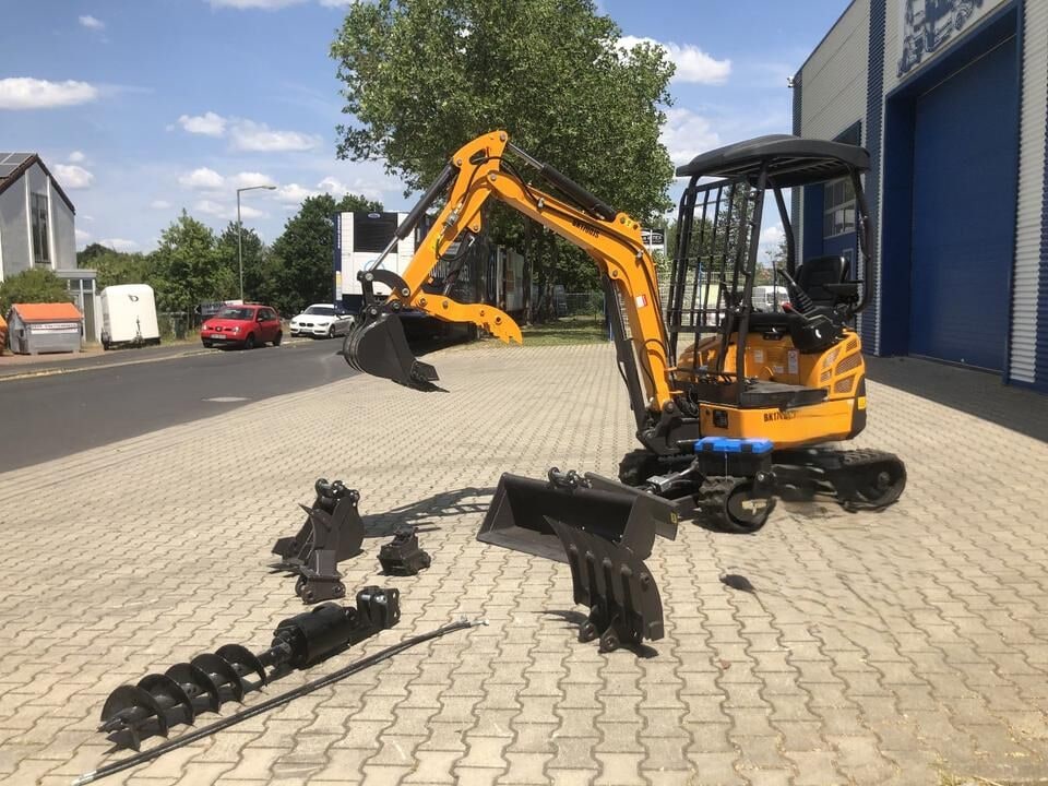 Berger Kraus BK1700JS mini excavator, side view with attachments